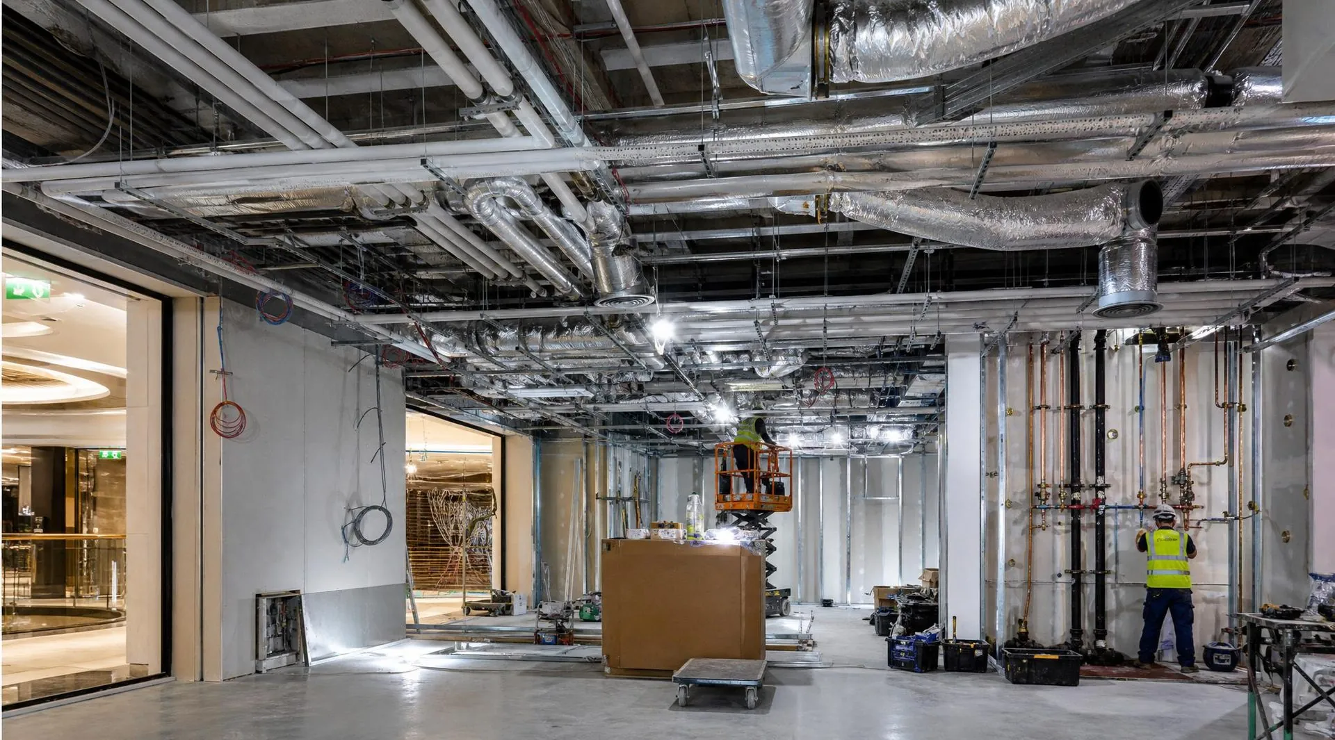 Tenant fit-out plumbing rough-in inside a retail unit at CF Toronto Eaton Centre